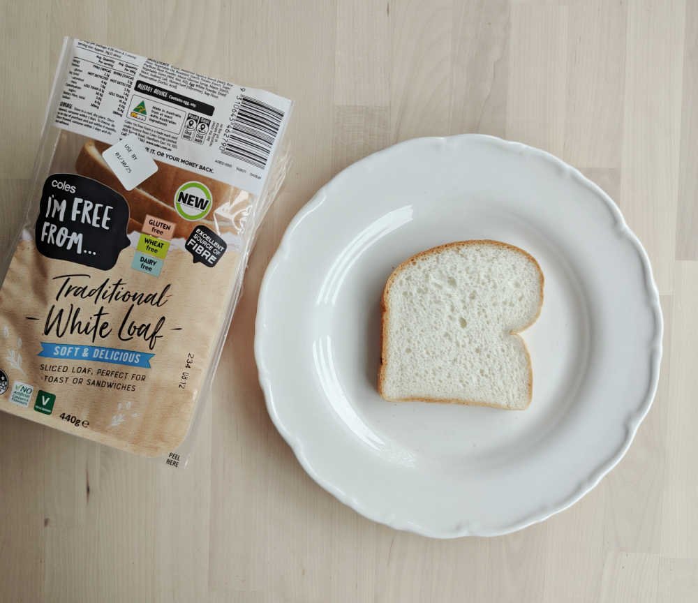 A slice of Coles Im'm Free From next to the bag.