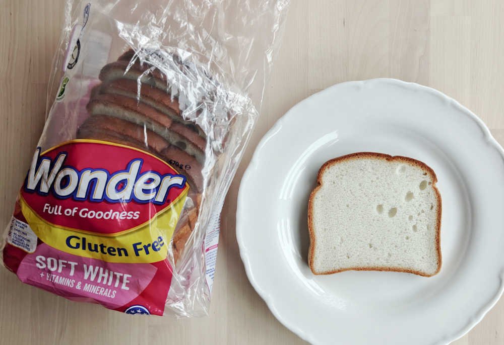 Wonder Gluten Free Soft White Bread next to a slice on a plate.